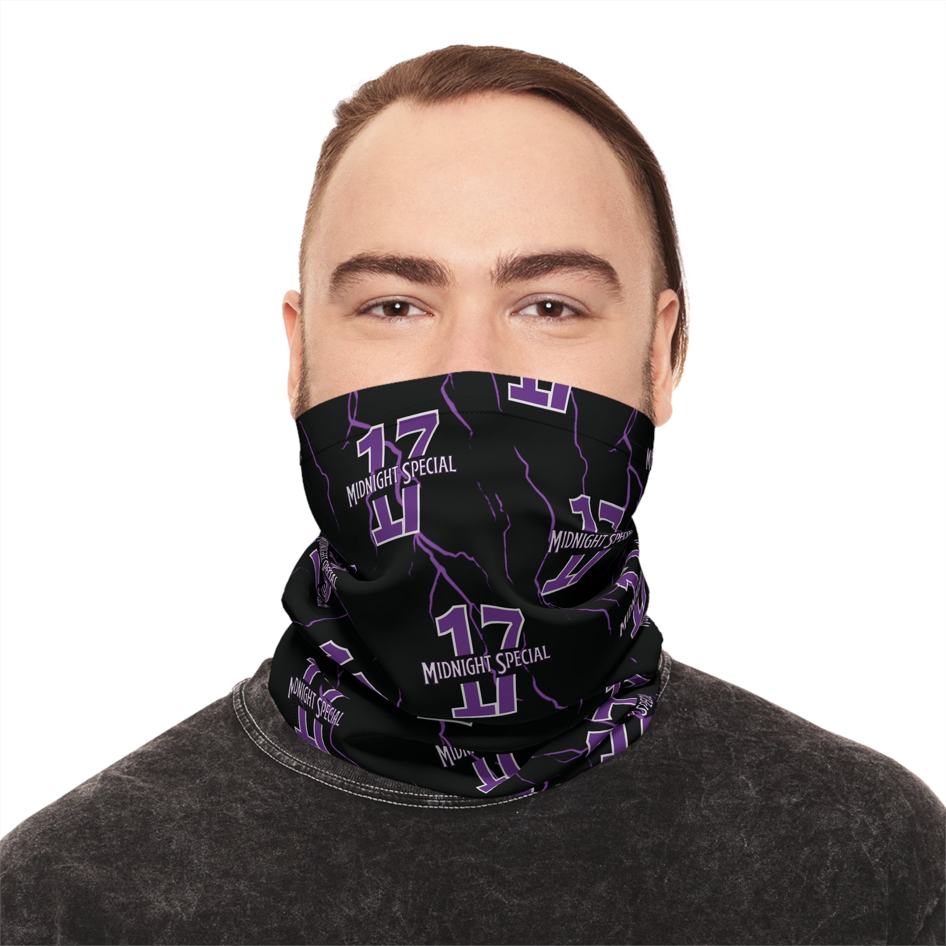 A person wearing a black and purple checkered neck gaiter covering the nose and mouth.