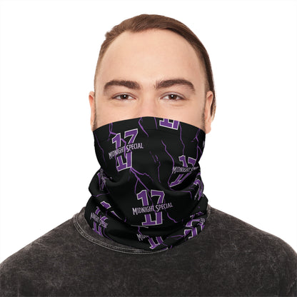 A person wearing a black and purple checkered neck gaiter covering the nose and mouth.