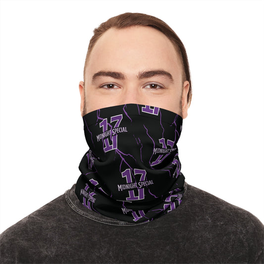 A person wearing a black and purple checkered neck gaiter covering the nose and mouth.