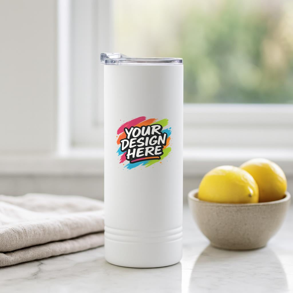 The same white skinny tumbler on a marble kitchen counter beside lemons and a linen towel, showing the printed area straight on